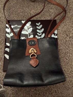 Vintage Black Leather Shoulder Bag with Brown Trim and Gold Hardware